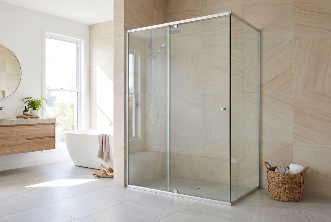 Framed glass shower screen in a tiled bathroom