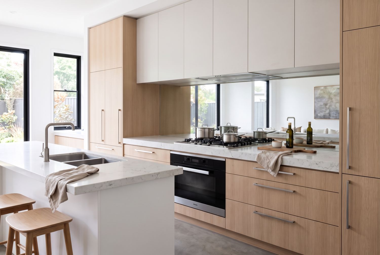 Kitchen with a mirrored splashback