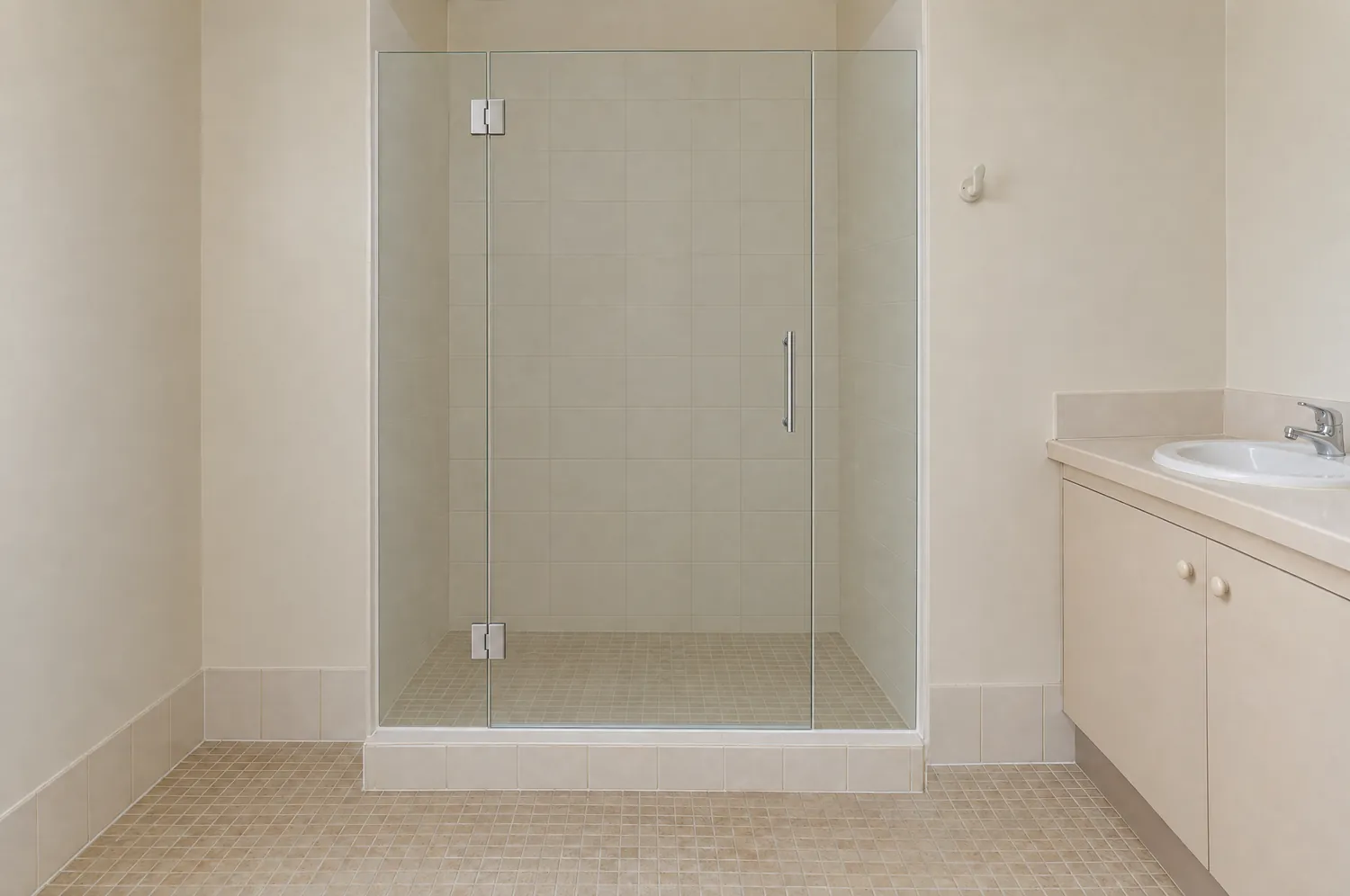 Frameless clear glass shower screen with a hinged door